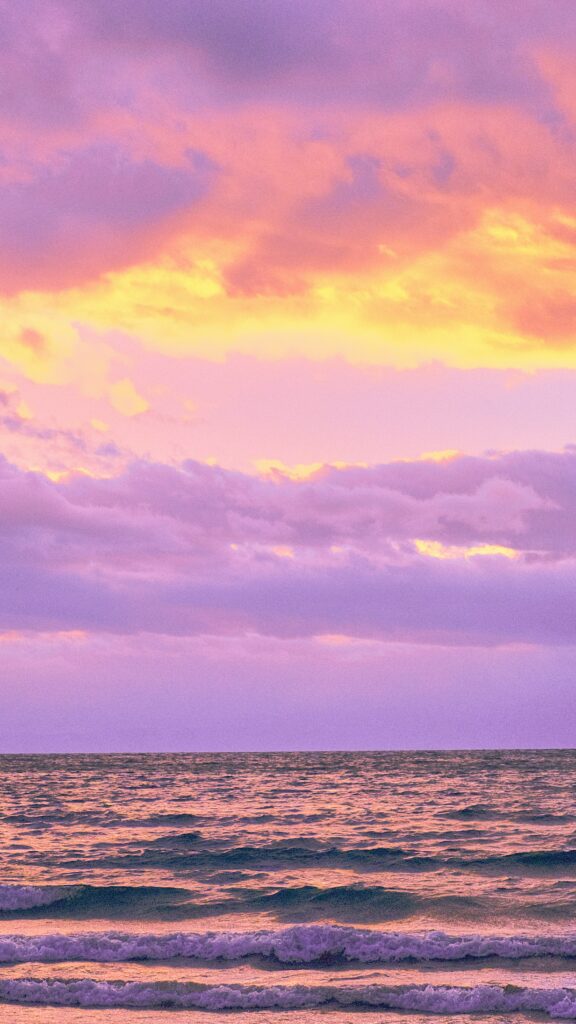 sunset on the water with clouds